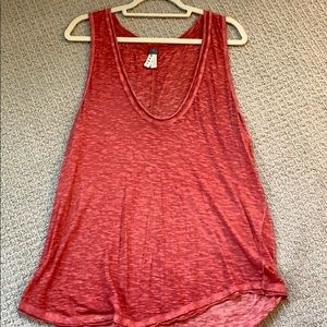 Amber-orangish tank top from free people.